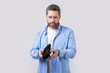 photo of poor broke man with wallet. broke man with wallet isolated on studio background