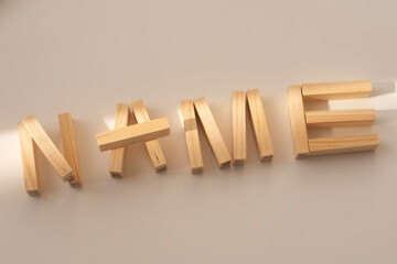 the word name made of wooden blocks, brand and naming concept.