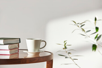 This room has a calm atmosphere with natural light. There are clay pots, glass bottles, coffee and various objects on the table.
