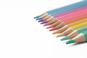 Naklejka premium Close up of colorful colored pencils art education school supplies isolated on white