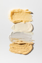 Samples and textures of various cosmetics for skin and hair care. Swatches. Skin care.