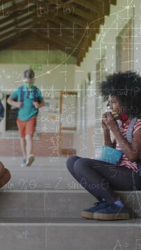 Animation of mathematical equations over diverse schoolchildren wearing face masks