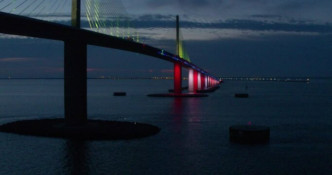 Sunshine Skyway Bridge in Florida at night with cars driving on road