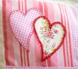 Fototapeten close up of hearts on pillow © Chimzoe Art