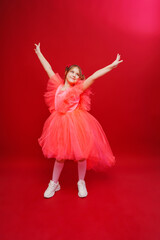 Naklejka premium a beautiful teenage girl with ponytails in a pink elegant dress. 