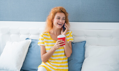 woman laugh with coffee talk on phone. woman at home talking on phone. phone talk at home of woman