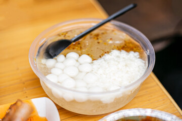 Sichuan dessert ice jelly with glutinous rice ball, sweet fermented rice and osmanthus syrup