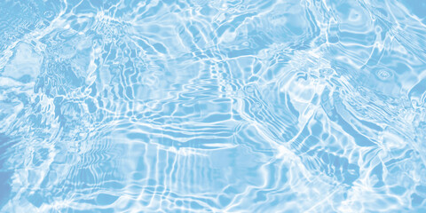 Water waves surface hits the sunlight. Close up swimming pool water background. Transparent water surface.