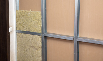Fototapeta premium Insulation and glass wool in the wall of the room