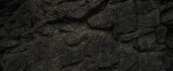 Natural black stone wall texture background