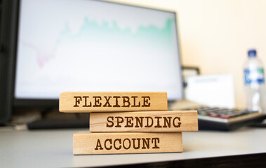 Naklejka premium Wooden blocks with words 'FLEXIBLE SPENDING ACCOUNT'. Business concept