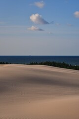 Beautiful holiday seaside landscape. Moving dunes in the desert in Slowinski National Park in Leba, Poland.