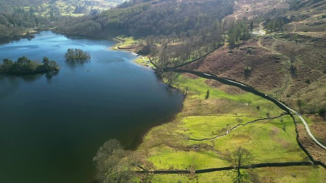 Flying along the south shore of Rydal Water in the English Lake District Cumbria