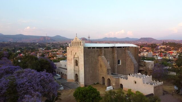 aerial view of church of tlayacapan and jacarandas