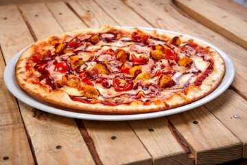 tasty pizza on the wooden background