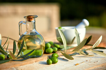 Freshly harvested olives berries and olive oil