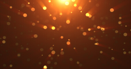 Abstract background of yellow orange gold glowing particles and bokeh dots of festive energy magic