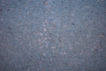 Background from polished granite slab. Gray granite texture, granite surface and background. Material for interior decoration.