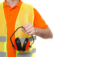 Civil engineer holds protective ear muffs, isolated on white background