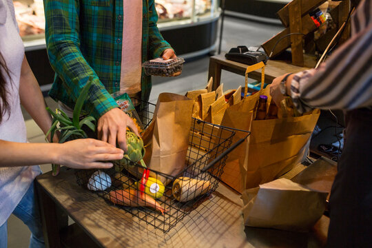 Customers holding shopping basket
