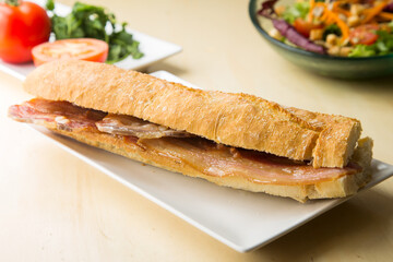 Delicious sandwich with bacon in mollete bread