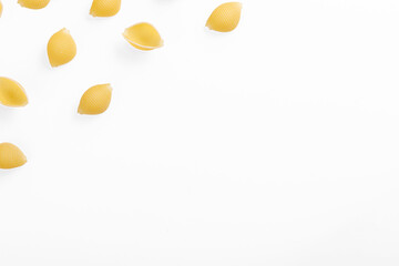 Pasta products in the form of a shell, texture, on a white background