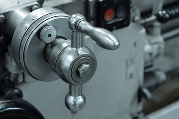This is part of close-up metal lathe. Industrial equipment for metal processing. Milling machine handle..