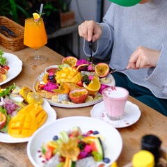 woman eating healthy breakfast on the table