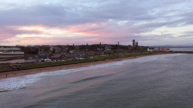 Aerial shot of Scottish coastal village at sunset, St Andrews