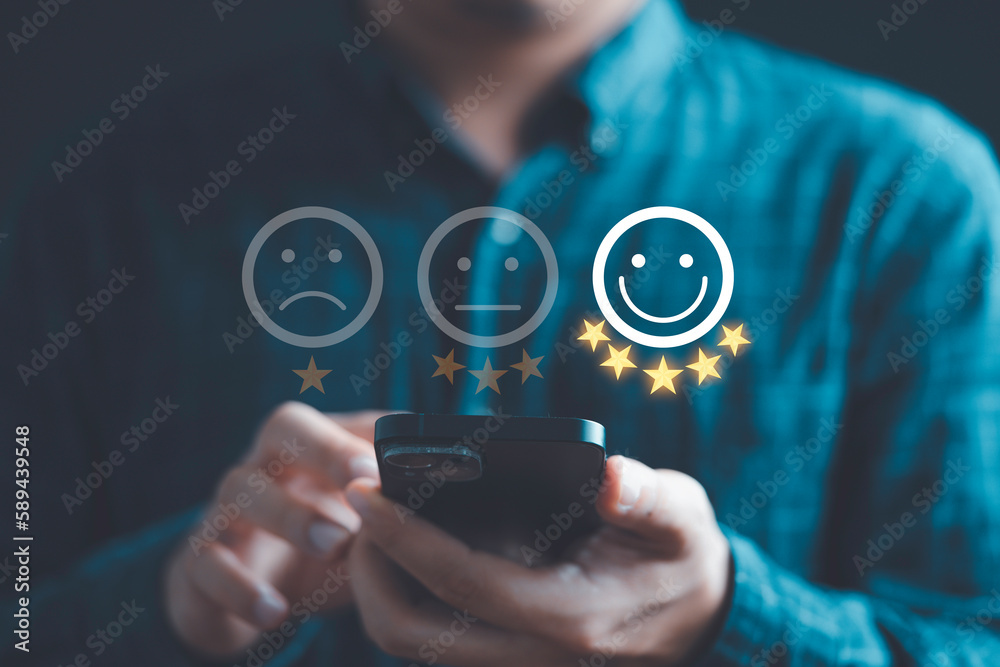 Poster Businessman using smartphone to give five glowing golden stars and smile face icon for excellent evaluation survey after client use product and service from customer satisfaction concept.