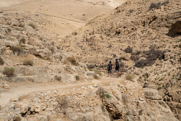 Fototapeta na wymiar Hikers in the Judea Desert, Israel