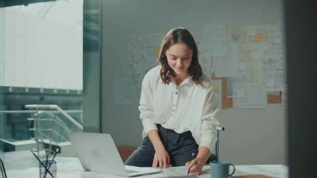 Confident Female Engineer is Typing on a Laptop Computer, Working Online on a New Project. Motivated Female Manager is Doing a New Project. Engineering and Creativity New Product Development