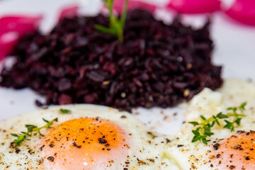 Traditional Brazilian recipe black rice with eggs and pickled onions