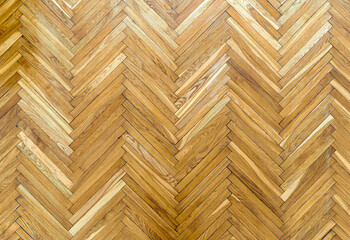 Wooden parquet floor background. Old vintage parquet on the floor in the living room. Interior design concept.