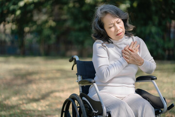 elderly woman suffers chest pain, concept health in old age and heart problems.