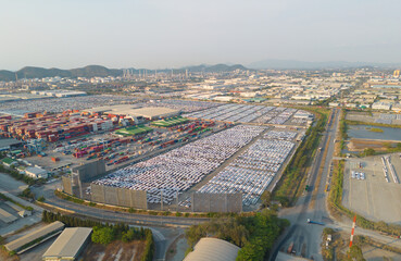 Aerial top view of new cars parking for sale stock lot row, dealer inventory import and export business commercial worldwide, Automobile and automotive industry distribution logistic global transport