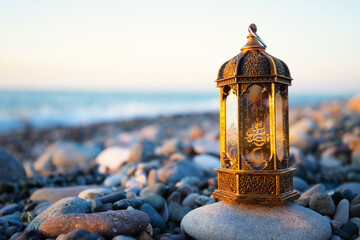 ramadan kareem iftar, muslim lantern lamp glows on the seashore at sunset,copy space