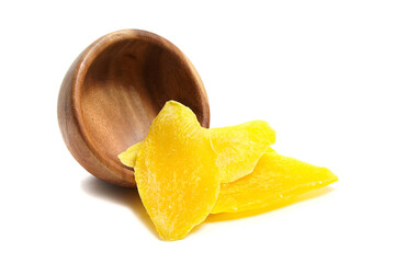 Dried mango slices in wooden bowl isolated on white background. Candied mango fruits