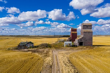 Drone view of the Lepine Grain Elevators in the yellow fields under the sunlight