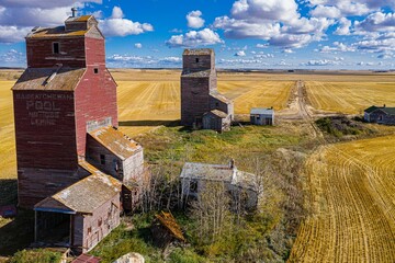 Drone view of the Lepine Grain Elevators before the yellow fields under the sunlight
