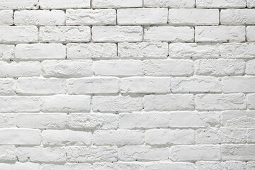 Cream and white brick wall texture background with Sunlight. Brickwork or stonework flooring interior rock old pattern clean concrete grid uneven bricks design stack.