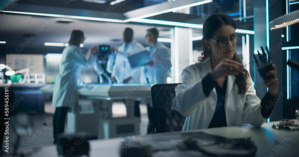 Aufkleber Talented Young Female Scientist Working on a Prosthetic Robotic Hand. Focus Switching to a Diverse Team of Industrial Specialists Working on Advanced Mobility Robot Dog with Artificial Intelligence