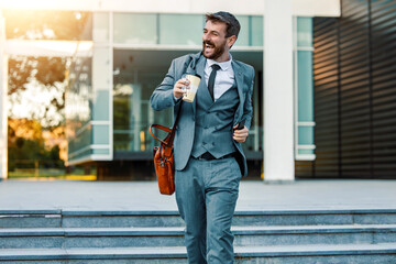 Businessman using mobile phone outside of office