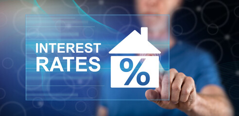 Man touching an interest rates concept
