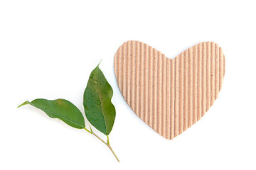 Cardboard heart with leaves on white background Pictures for Valentine's Day. Environment Day. with space for your text Wallpaper.