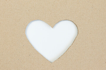 brown cardboard box. Cut into a heart shape.