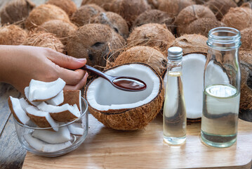 	 Virgin coconut oil liquid clear pure by cold pressed with HDL by Raw coconut milk in glass bottle. regular saturated fat good cholesterol in Virgin coconut oil liquid clear pure by cold pressed