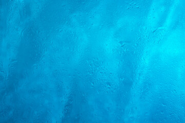 Drops of rain water droplets on glass