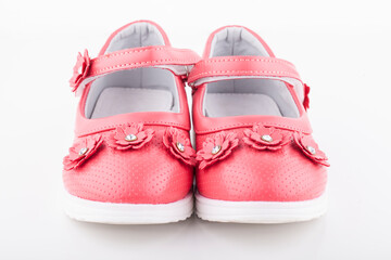 Shoes for the girl color coral on a white background