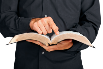 Closeup on a Priest Holding a Bible and Pointing Finger